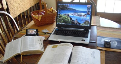 open books and computer on table